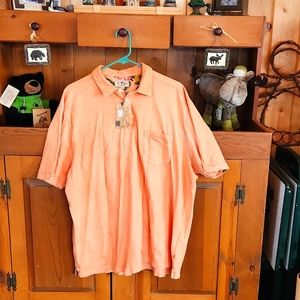 Men's XXL TRUE GRIT orange short sleeved t shirt with front pocket.